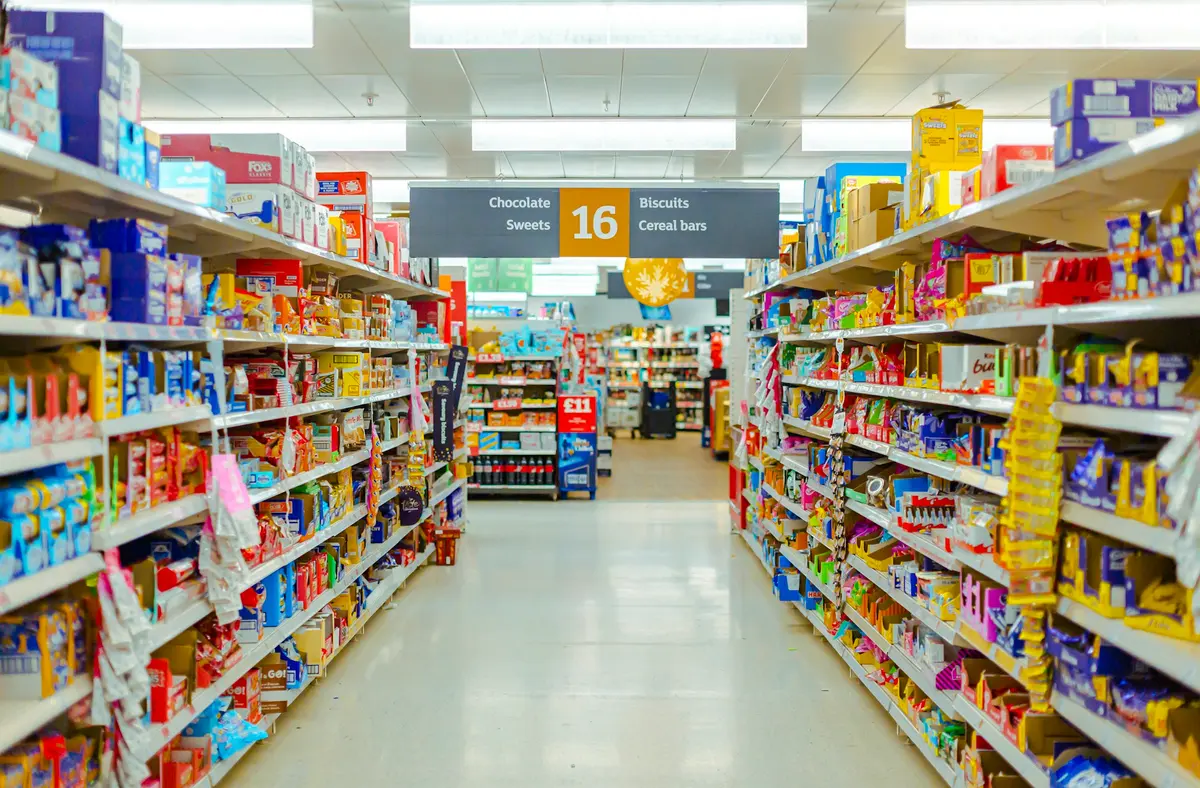 A grocery store aisle filled with food