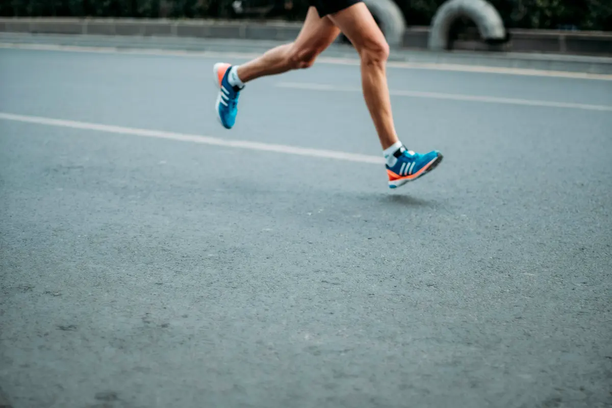 A pair of blue-and-white Adidas running shoes