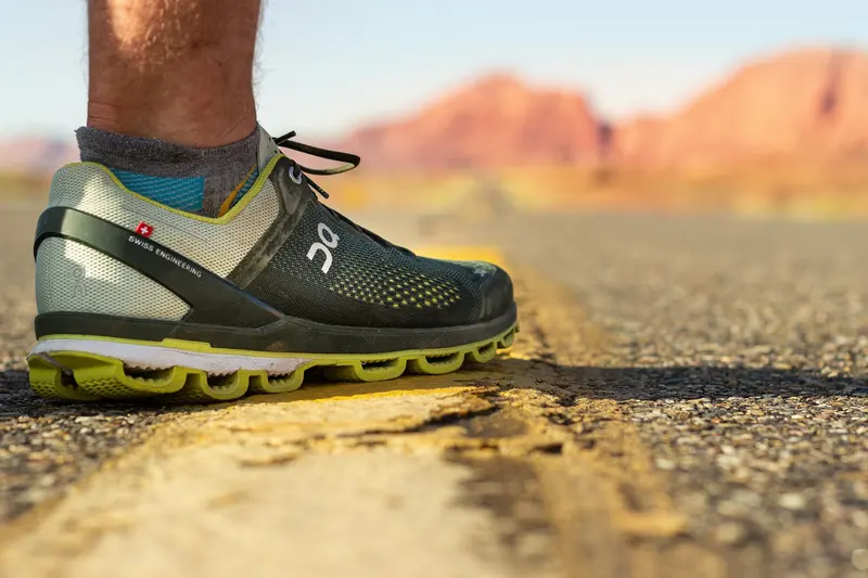 Runner mid-stride wearing bright running shoes